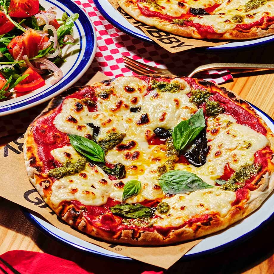 Cheesy Margherita Pizza with Pesto Drizzle & Rocket Salad